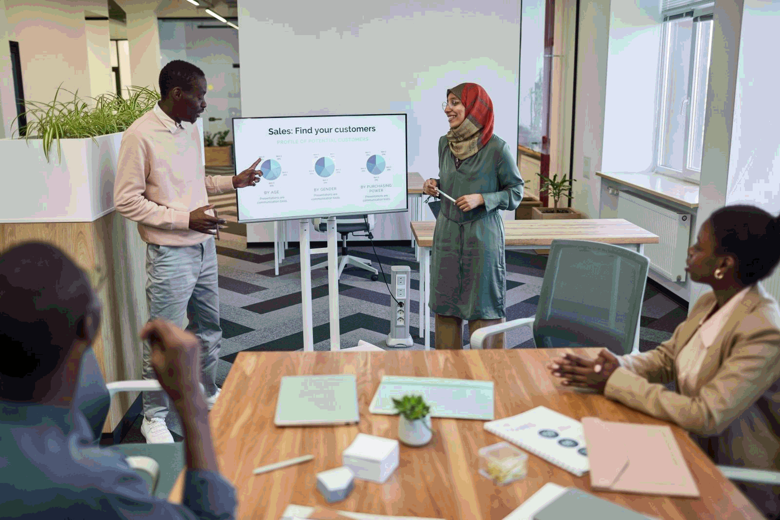 Sales team presenting strategy in a modern meeting room